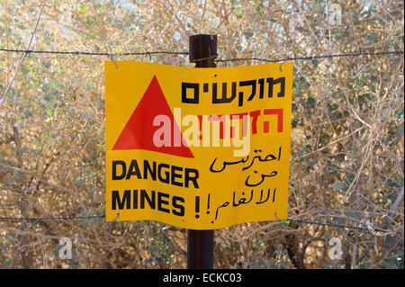 A warning sign with 'Danger Mines' written on it at a mine field on the Golan Heights in Israel Stock Photo