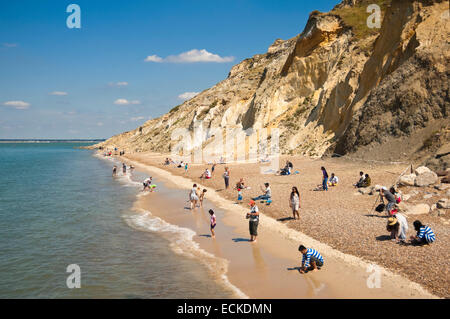 Horizontal view of tourists relaxing on the beach at Alum Bay in the Isle of Wight. Stock Photo