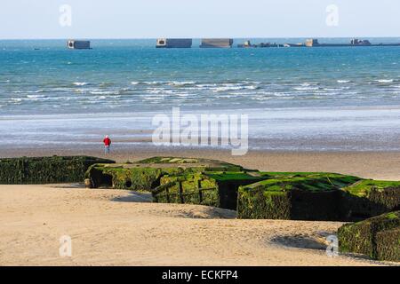France, Calvados, Arromanches les Bains, historic place of the Normandy landings, remains of the artificial harbour Mulberry B or Winston harbour on the beach Stock Photo