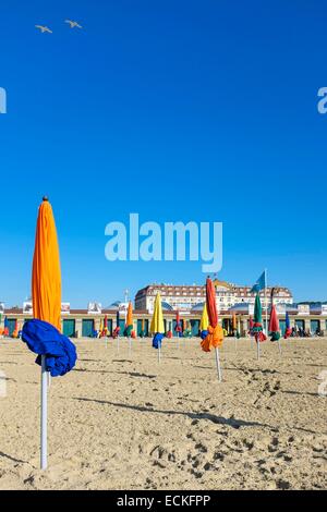 France, Calvados, Pays d'Auge, Deauville, the beach and its 600 parasols, the luxury hotel Royal Barriere in the background Stock Photo