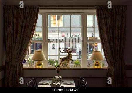 United Kingdom, Scotland, Argyll and Bute, Lochgilphead, view of Main Street from inside the living room of a restaurant in the early morning Stock Photo