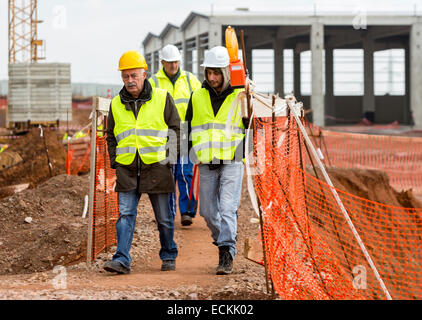Sofia, Bulgaria - November 24, 2014: Engineers are walking at a construction site of a new waste plant near Sofia. Stock Photo