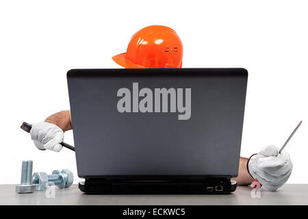 Mechanic is trying to repair an old computer. Stock Photo