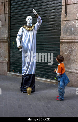 Street performer and child Valencia Spain Stock Photo