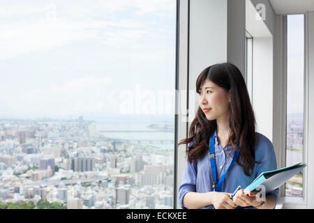 A working woman in an office building. Stock Photo