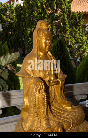 Statue of Avalokitesvara Bodhisattva, seated on lotus throne, atop two dragons, Buddhist temple, Hsi Lai Temple, Hacienda Heights, California Stock Photo