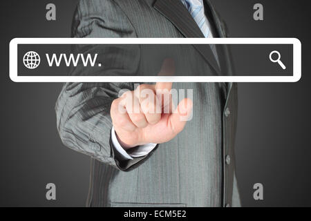 Businessman pushing virtual search bar on black background, internet concept Stock Photo