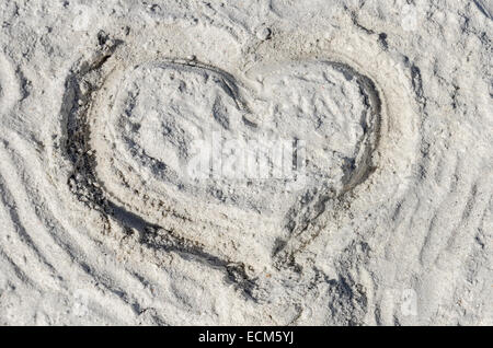 The symbol of heart is drawn on sand Stock Photo