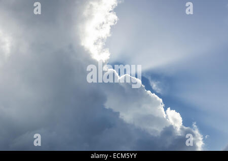 Sun rays striking through clouds Stock Photo