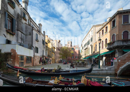 tourist posing for photo on goldola, Venice, Italy Stock Photo