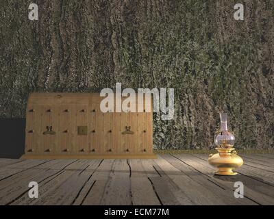 One old wooden chest against wall and on the floor next to oil lamp Stock Photo