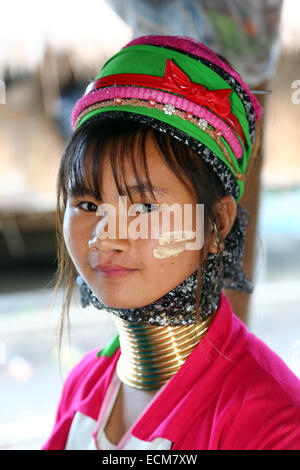 Giraffe women wearing brass rings on their necks in the Long Necked Karen village in Chiang Rai province in Thailand Stock Photo