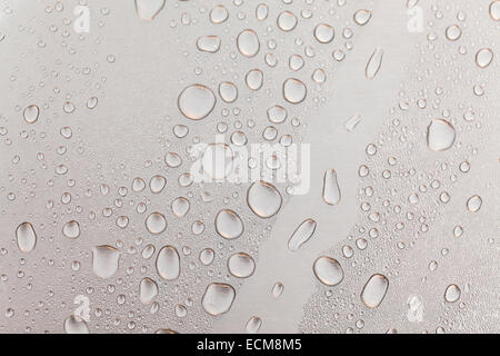 Metal surface covered in water drops bottom, closeup. Stock Photo