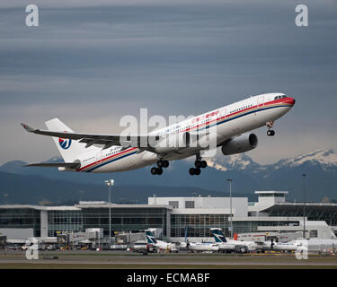 China Eastern Airlines Airbus A330-200 (B-5943) airliner departs from Vancouver International Airport, Canada. Stock Photo