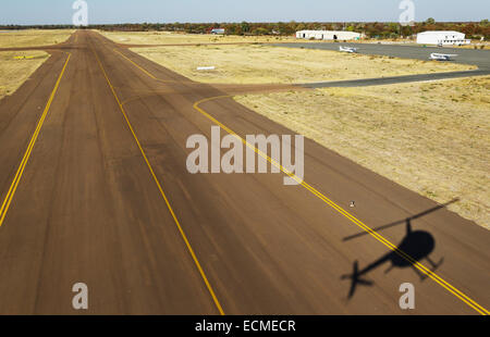 Helicopter approaching the airport of Maun, Okavango Delta, Botswana Stock Photo