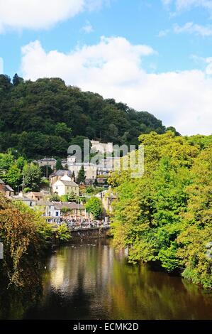 View along the River Derwent with town buildings on the hillside, Matlock Bath, Derbyshire, England, UK, Western Europe. Stock Photo