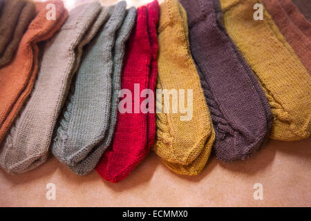 Colorful woolen knitted mittens lying on the counter in Finland Stock Photo