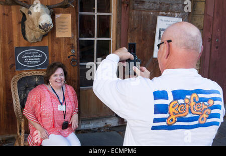 Bergen Norway Bryggen tourists taking picture in front of moose head MR-12 Stock Photo