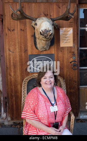 Bergen Norway Bryggen woman tourist in front of moose head MR-12 Stock Photo