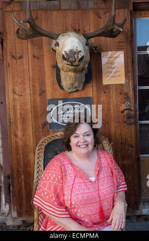 Bergen Norway Bryggen woman tourist in front of moose head MR-12 Stock Photo