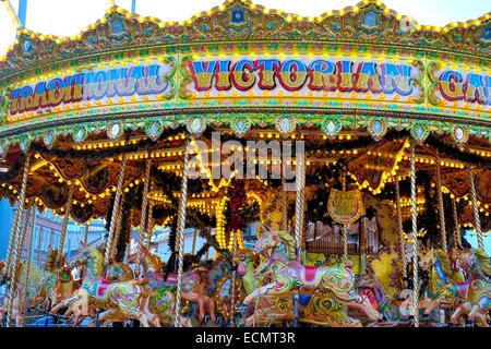 Victorian galloping horses fairground carousel. Nottingham Christmas market England UK Stock Photo