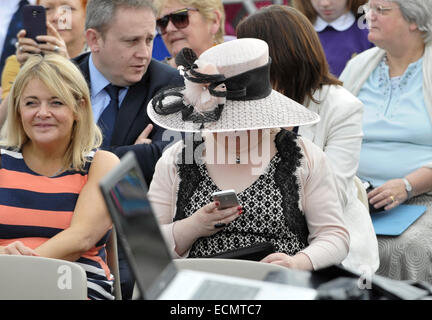 Susan Boyle attended her local Children's Gala Day in Blackburn, West Lothian. Susan checks her mobile phone during the ceremony  Featuring: Susan Boyle Where: Blackburn, United Kingdom When: 14 Jun 2014 Stock Photo