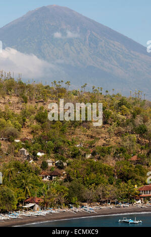 The small village of Amed fisherman with views of Mount Gunung Agung background (3142m). East Bali. Amed is a long coastal strip Stock Photo