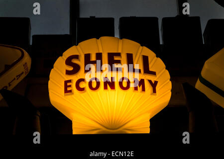 Shell economy illuminated sign from top of old garage fuel pump Bourton-on-the-Water Gloucestershire England Stock Photo