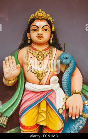 Mauritius, Mahebourg, Hindu temple, colourfully painted figure of Kartikeya with blue peacock Stock Photo