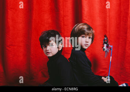 Studio portrait of two boys wearing black clothes Stock Photo