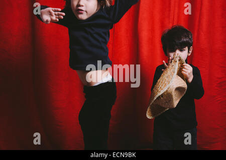 Studio portrait of two boys wearing black clothes Stock Photo