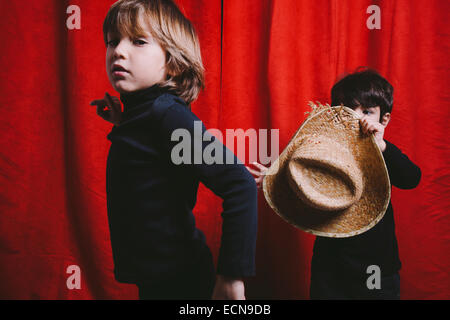 Studio portrait of two boys wearing black clothes Stock Photo