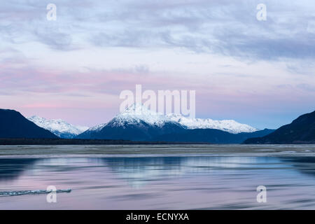 Alpenglow at sunrise along the Chilkat River with the Chilkat Mountains in the Chilkat Bald Eagle Preserve in Haines, Alaska. Stock Photo