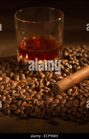 Selective Focus On The Cuban Cigar Lying Heap Of Coffee Beans Glass Selective Focus On The Cuban Cigar Lying Heap Of Coffee Beans Glass