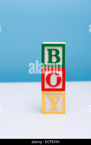 Building blocks for a child stacked to read BOY Stock Photo