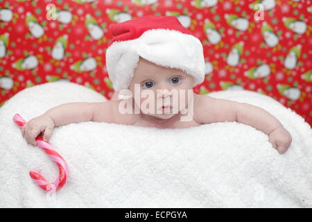 Baby boy in a Santa hat Stock Photo