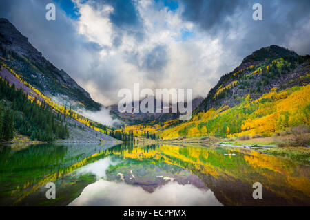 The Maroon Bells are two peaks in the Elk Mountains, Maroon Peak and North Maroon Peak, separated by about a third of a mile. Stock Photo
