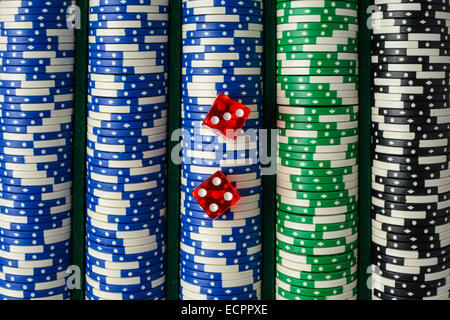 Dice on a Stack of Poker Chips Stock Photo