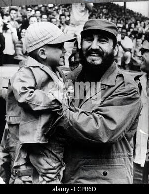 The US and Cuba announced an agreement between the two countries that will be a first step toward normalizing relations. PICTURED: Feb. 16, 1965 - Havana, Cuba - FIDEL ALEJANDRO CASTRO RUIZ (born August 13, 1926), ruler of Cuba since 1959, when, leading the 26th of July Movement, he overthrew the regime of Fulgencio Batista. In the years that followed he oversaw the transformation of Cuba into the first Communist state in the Western Hemisphere. PICTURED: Major Castro takes a picture with a very young baseball enthusiast at the American Stadium havana. (Credit Image: © KEYSTONE Pictures USA/ZU Stock Photo