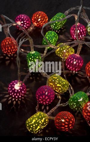 Christmas lights. Multicoloured lanterns made in India, with LED bulbs inside. Stock Photo