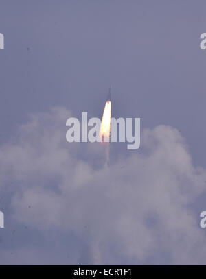 Sriharikota, India. 18th December, 2014. Indian Space Research Organisation's Geosynchronous Satellite Launch Vehicle-Mark III (GSLV-Mark III) rocket lifts off carrying Crew Module Atmospheric Re-entry Experiment (CARE) from the east coast island of Sriharikota, India, on Dec. 18, 2014. India on Thursday successfully launched its heaviest rocket with an experimental crew module from the spaceport of Sriharikota in the southern state of Andhra Pradesh, said Indian Space Research Organization (ISRO). (Xinhua/Stringer) Credit:  Xinhua/Alamy Live News Stock Photo