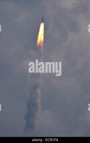 Sriharikota, India. 18th December, 2014. Indian Space Research Organisation's Geosynchronous Satellite Launch Vehicle-Mark III (GSLV-Mark III) rocket lifts off carrying Crew Module Atmospheric Re-entry Experiment (CARE) from the east coast island of Sriharikota, India, on Dec. 18, 2014. India on Thursday successfully launched its heaviest rocket with an experimental crew module from the spaceport of Sriharikota in the southern state of Andhra Pradesh, said Indian Space Research Organization (ISRO). (Xinhua/Stringer) Credit:  Xinhua/Alamy Live News Stock Photo