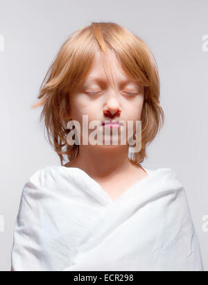 Portrait of a Boy with Closed Eyes - Isolated on Gray Stock Photo