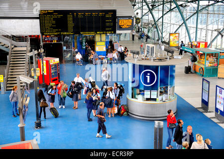 Lille, Pas de Calais, France. Gare de Lille Europe (railway station serving Eurostar trains) - departure board and waiting passe Stock Photo