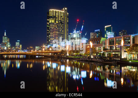 MELBOURNE, AUSTRALIA - JUNE 26 - Melbourne's famous skyline along Southbank with Crown Casino fire show on June 26th 2013. Stock Photo