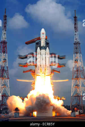 Sriharikota, India. 18th Dec, 2014. Indian Space Research Organisation's Geosynchronous Satellite Launch Vehicle-Mark III (GSLV-Mark III) rocket lifts off carrying Crew Module Atmospheric Re-entry Experiment (CARE) from the east coast island of Sriharikota, India, on Dec. 18, 2014. India on Thursday successfully launched its heaviest rocket with an experimental crew module from the spaceport of Sriharikota in the southern state of Andhra Pradesh, said Indian Space Research Organization (ISRO). Credit:  ISRO/Xinhua/Alamy Live News Stock Photo
