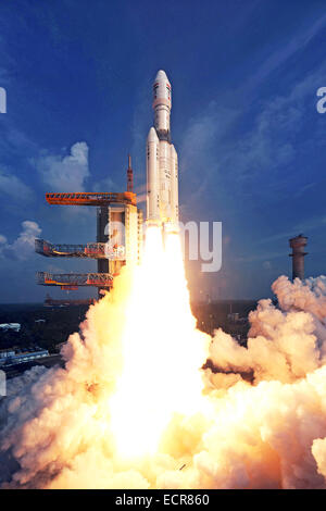 Sriharikota, India. 18th Dec, 2014. Indian Space Research Organisation's Geosynchronous Satellite Launch Vehicle-Mark III (GSLV-Mark III) rocket lifts off carrying Crew Module Atmospheric Re-entry Experiment (CARE) from the east coast island of Sriharikota, India, on Dec. 18, 2014. India on Thursday successfully launched its heaviest rocket with an experimental crew module from the spaceport of Sriharikota in the southern state of Andhra Pradesh, said Indian Space Research Organization (ISRO). Credit:  ISRO/Xinhua/Alamy Live News Stock Photo