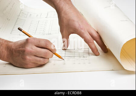 hand draws a pencil on the drawing Stock Photo