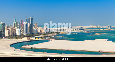 Bird view panorama of Manama city, Bahrain. Skyline with modern skyscrapers on the coast of Persian Gulf Stock Photo