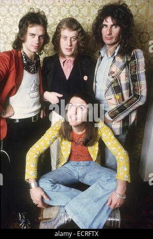 SLADE UK pop group about 1973. From left: Jim Lea, Noddy Holder,Dave Hill (seated) Don Powell Stock Photo